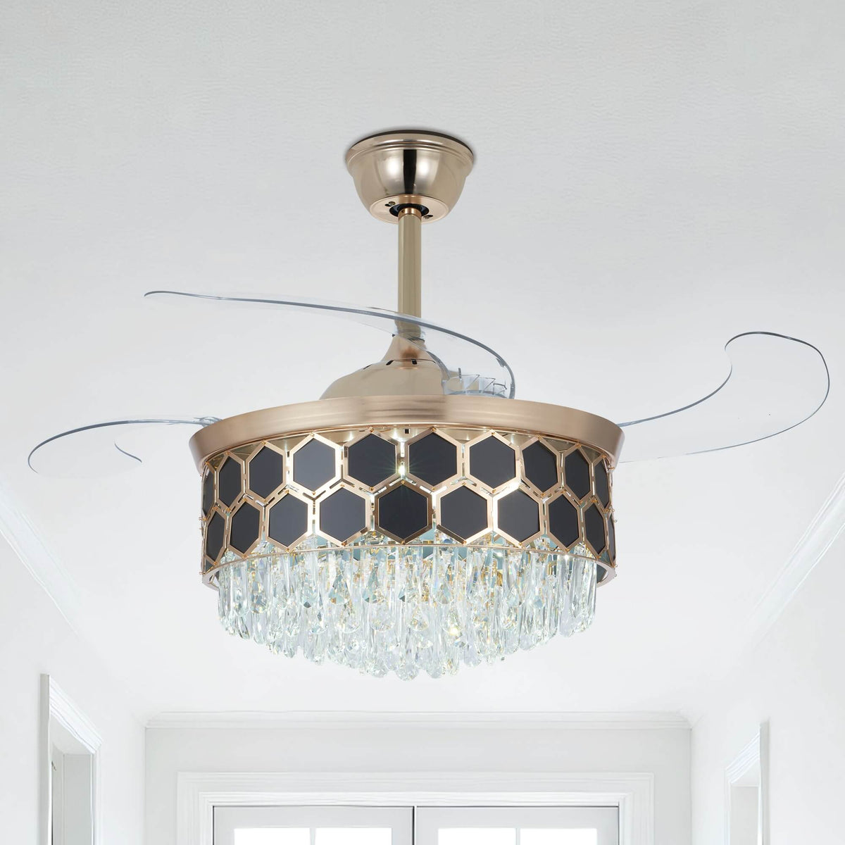 A gold chandelier ceiling fan with four crystal-trimmed tiers and clear retractable blades.